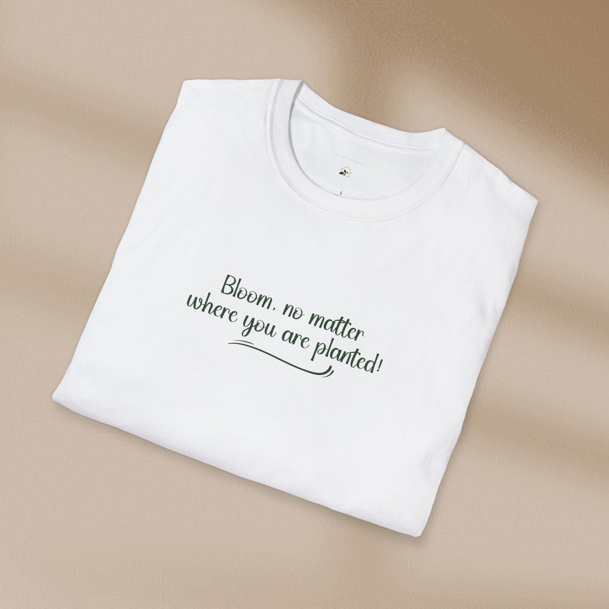 White t-shirt with text on a beige background