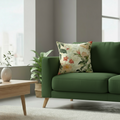 Green sofa with a floral pillow in a living room setting