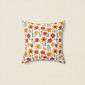 Decorative pillow with a floral pattern on a white background
