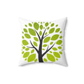 Decorative pillow with a tree design featuring green leaves and a black trunk on a white background.