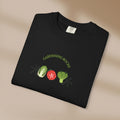 Black t-shirt with 'Gardening Rocks' text and vegetable graphics on a beige background