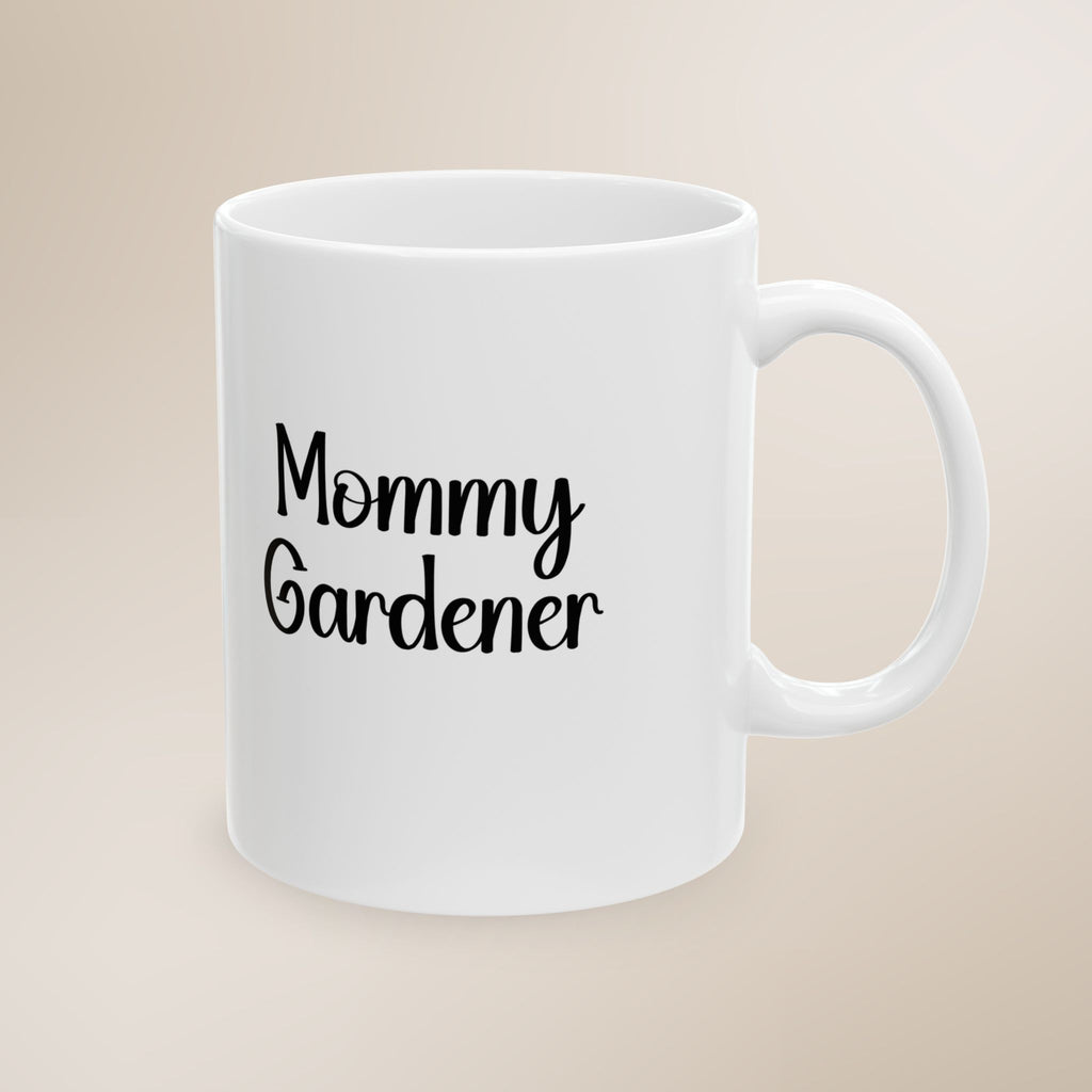 White mug with 'Mommy Gardener' text on a beige background