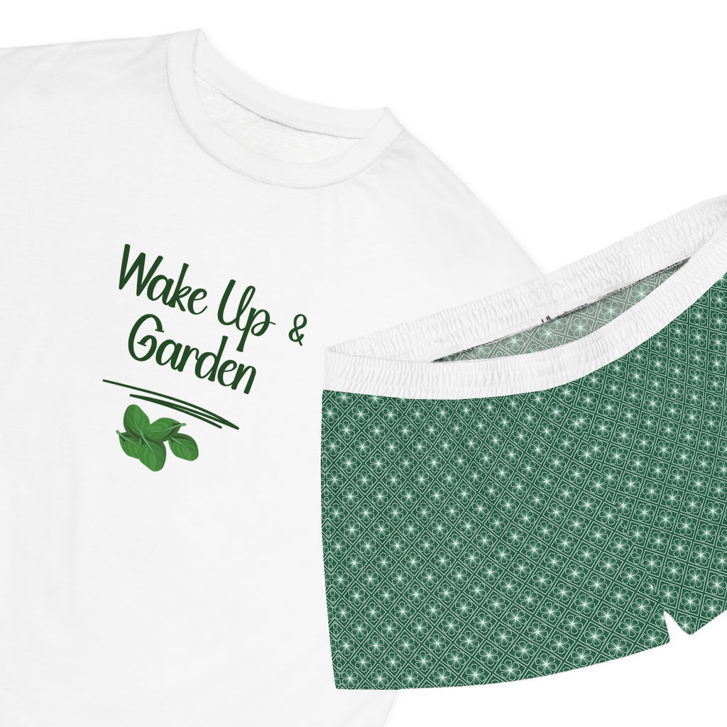 White t-shirt with 'Wake Up & Garden' text and green leaf graphic, folded on a white background.