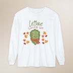 White long-sleeve shirt with a cartoon lettuce character and 'Lettuce Layer Up' text on a beige background