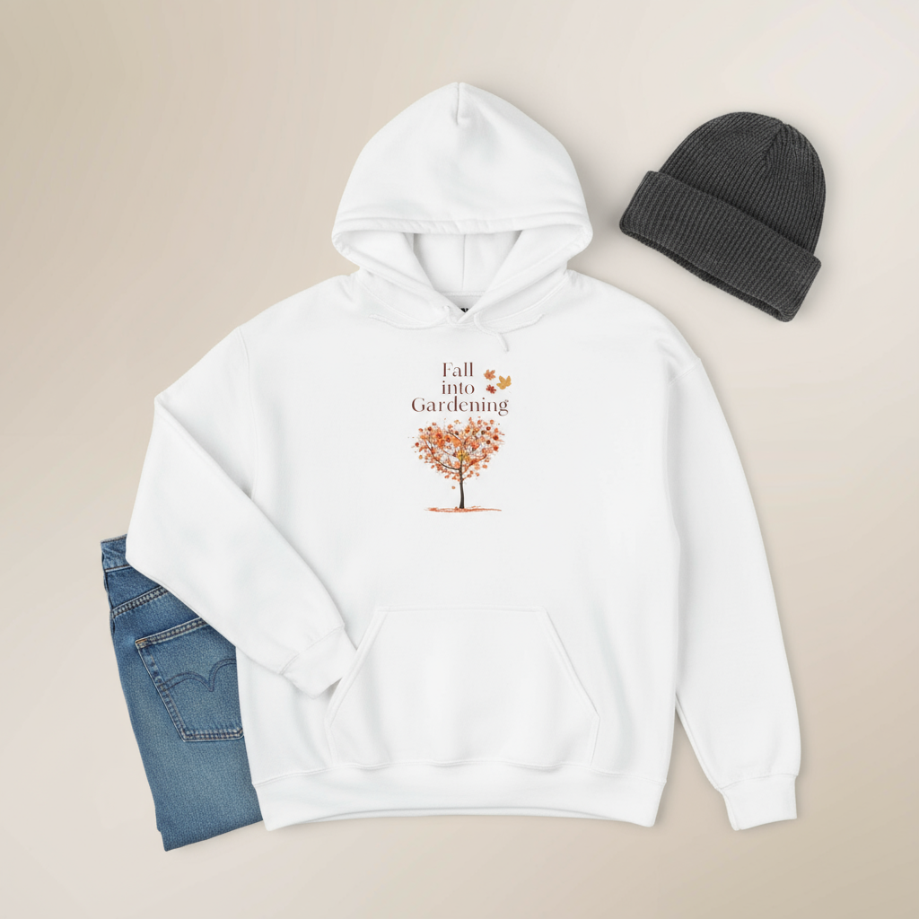 White hoodie with a tree graphic and text, paired with a black beanie and blue jeans on a beige background