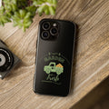 Black phone case with 'Garden Fresh' design on a wooden surface