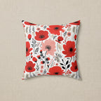 Floral-patterned pillow with red and pink flowers on a white background