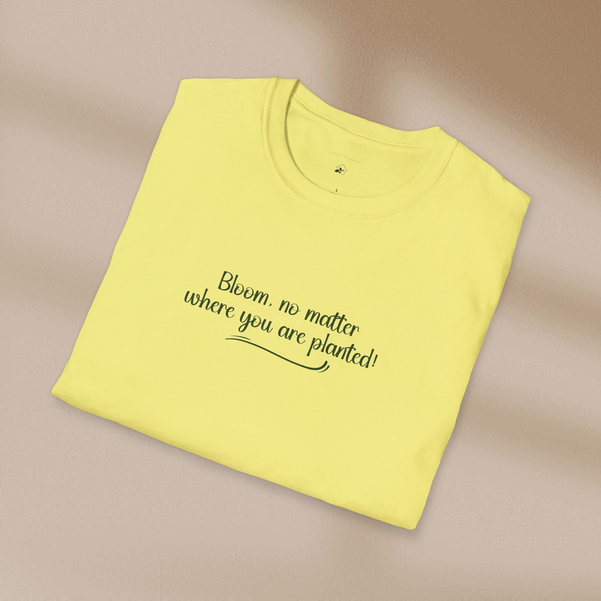 Yellow t-shirt with text on a beige background