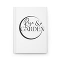 White notebook with 'Rise & Garden' design on a white background
