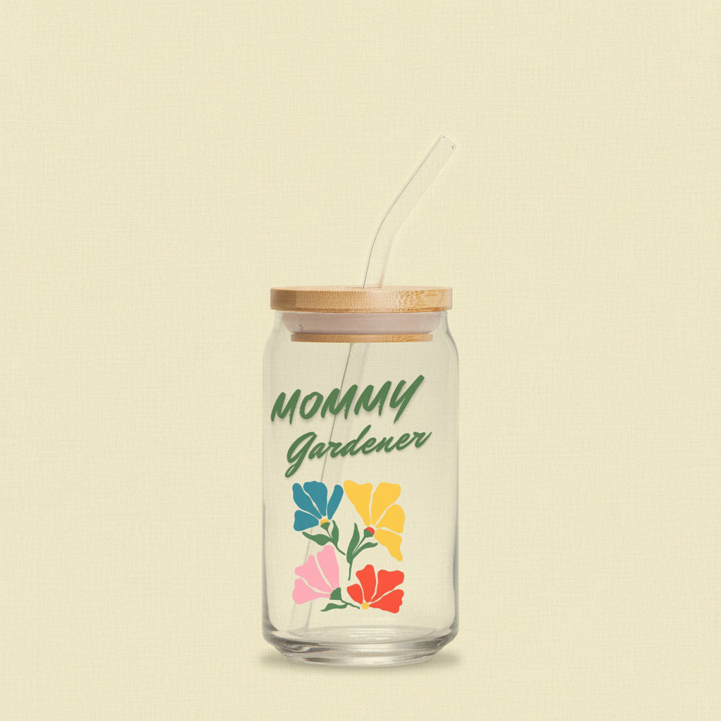 Glass tumbler with bamboo lid and straw featuring 'Mommy Gardener' text and floral designs on a white background.