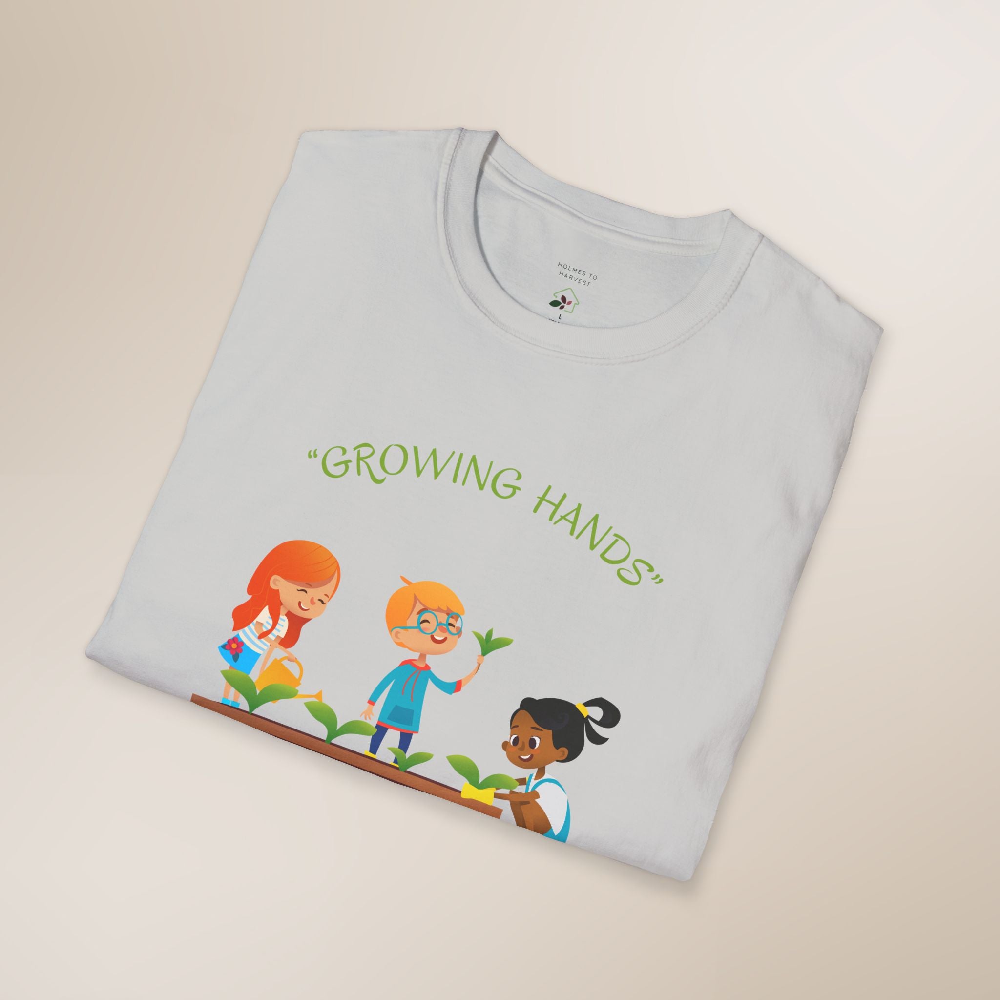 Folded t-shirt with 'Growing Hands' design on a beige background