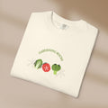 White t-shirt with 'Gardening Rocks' design on a beige background