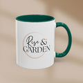 White mug with green interior and handle featuring 'Rise & Garden' text on a beige background