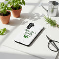 White phone case with 'Wake Up & Garden' text and leaf design on a white background