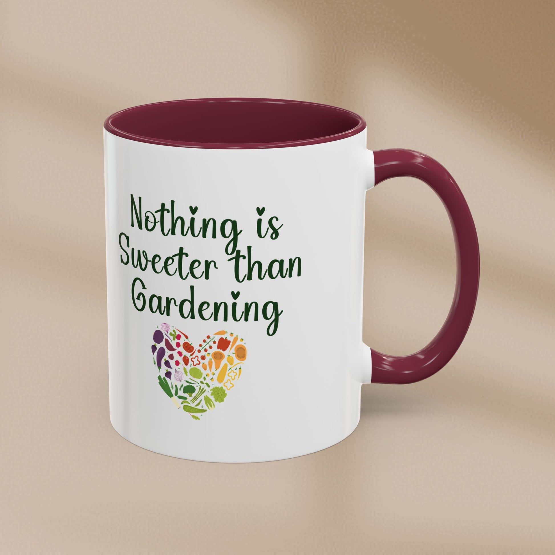 White mug with purple interior and handle featuring 'Nothing is Sweeter than Gardening' text and heart design on a beige background.