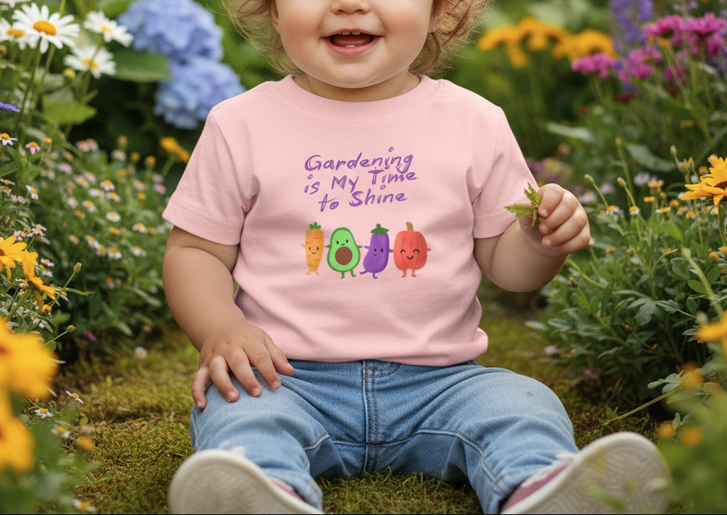Pink t-shirt with cartoon vegetables and text on a beige background