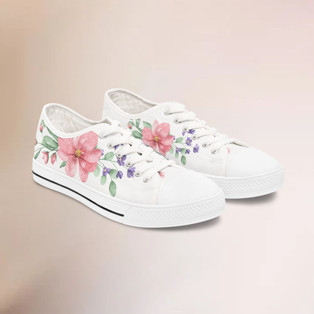 White sneakers with floral designs on a beige background