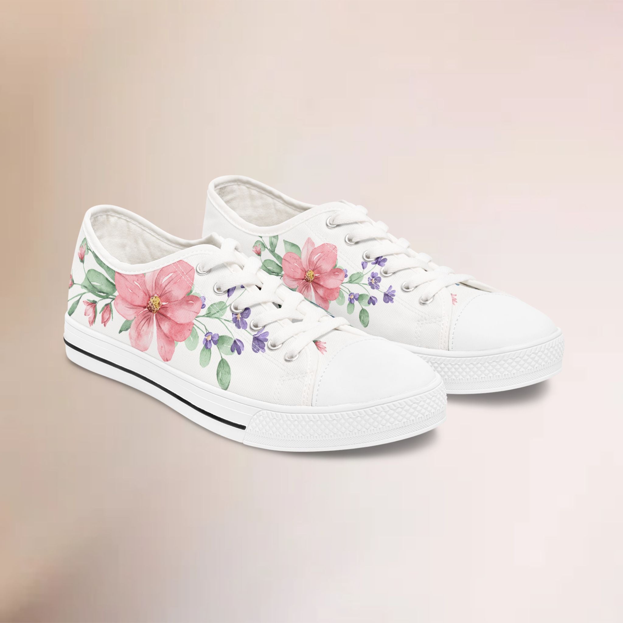 White sneakers with floral designs on a beige background