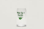 Clear glass tumbler with 'Wake Up & Garden' text and leaf design on a white background