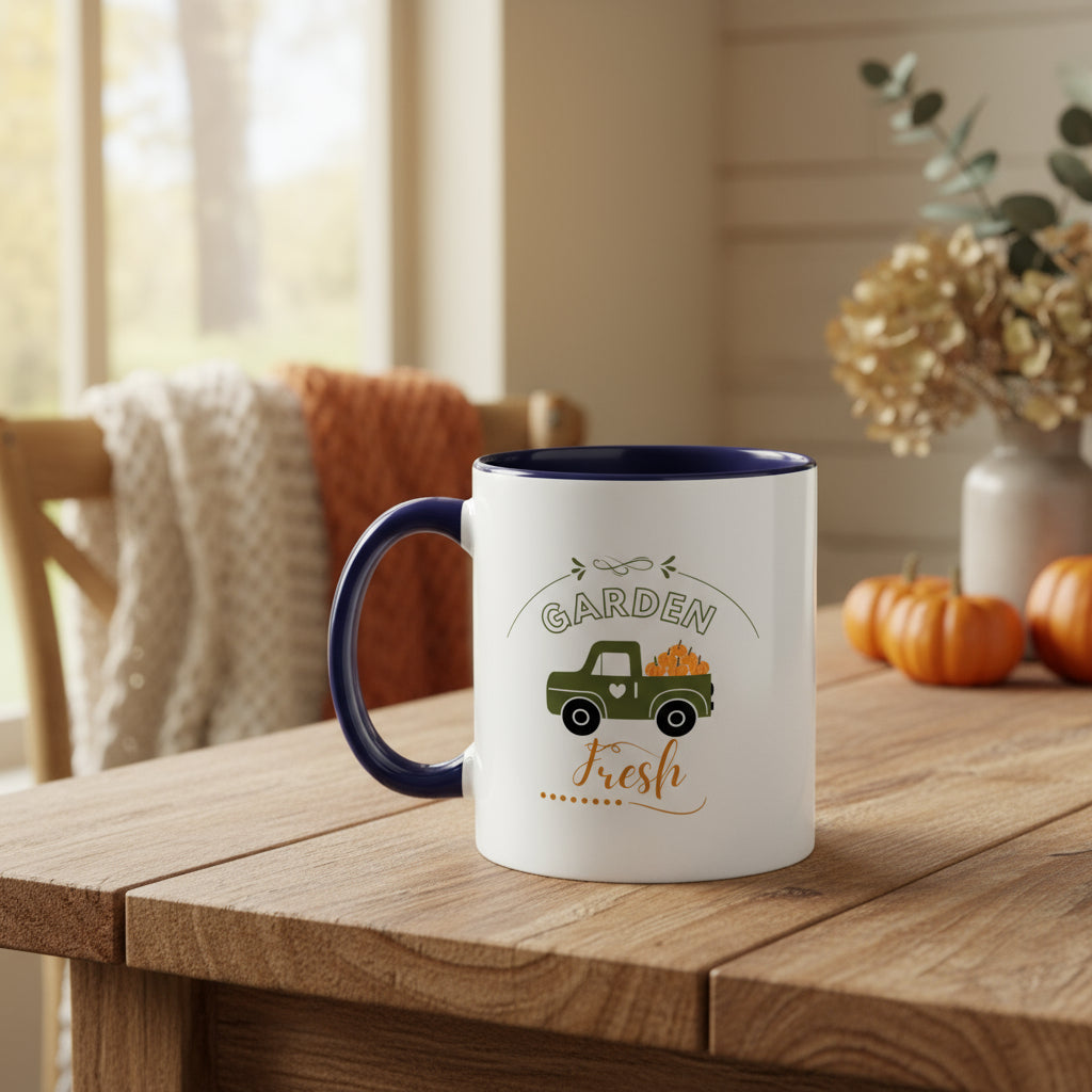 White mug with blue interior and handle featuring a green truck and 'Garden Fresh' text on a beige background