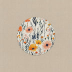 Round floral coaster with orange and pink flowers on a white background