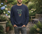 Man wearing a navy blue sweatshirt with 'Gardening is My Therapy!' text in a garden setting