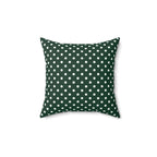 Green pillow with white polka dots on a white background