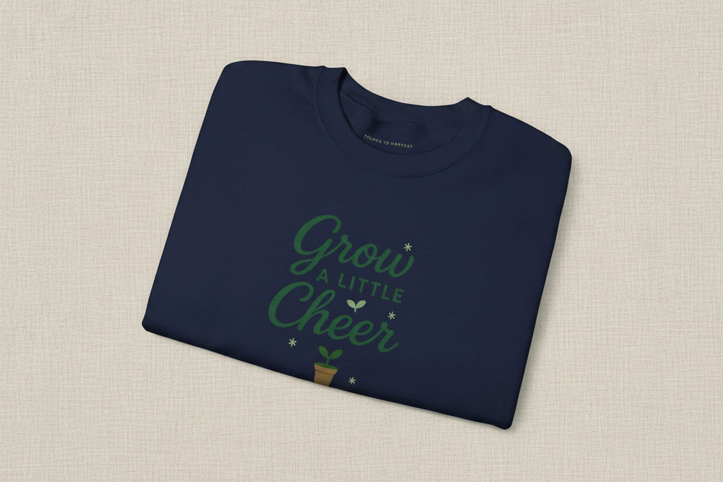 Folded black sweatshirt with 'Perfectly Imperfect' text on a white background