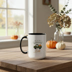 White mug with black interior and handle, featuring a design of a truck with pumpkins and 'Garden Fresh' text on a beige background.