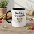 White mug with 'Gardening Grandma' text and heart design on a wooden table with gardening tools.