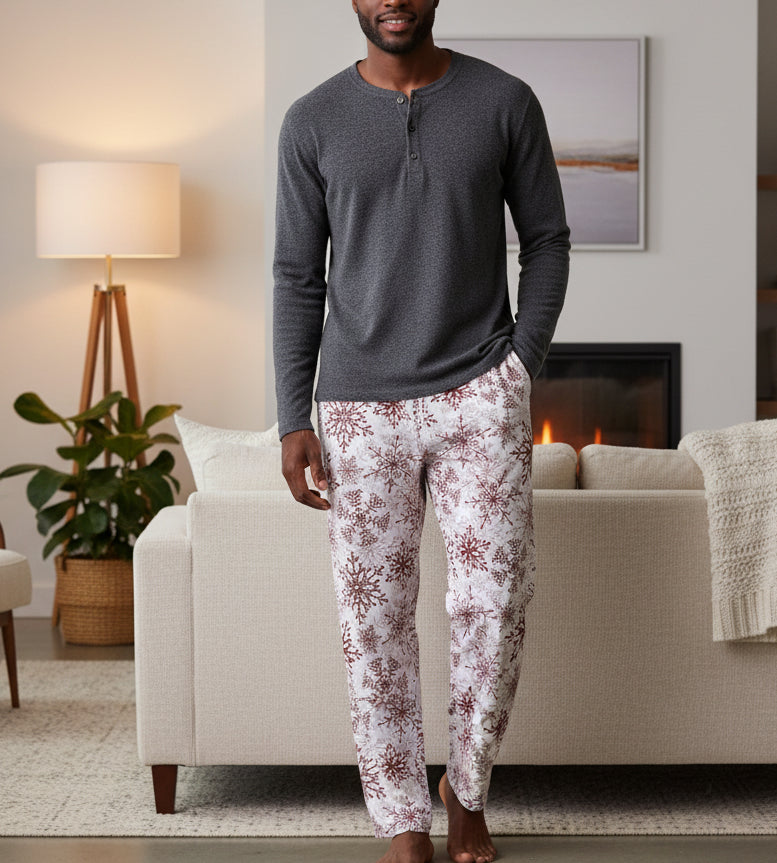 Pajama pants with red snowflake pattern on a beige background