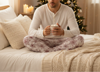 Pajama pants with red snowflake pattern on a beige background