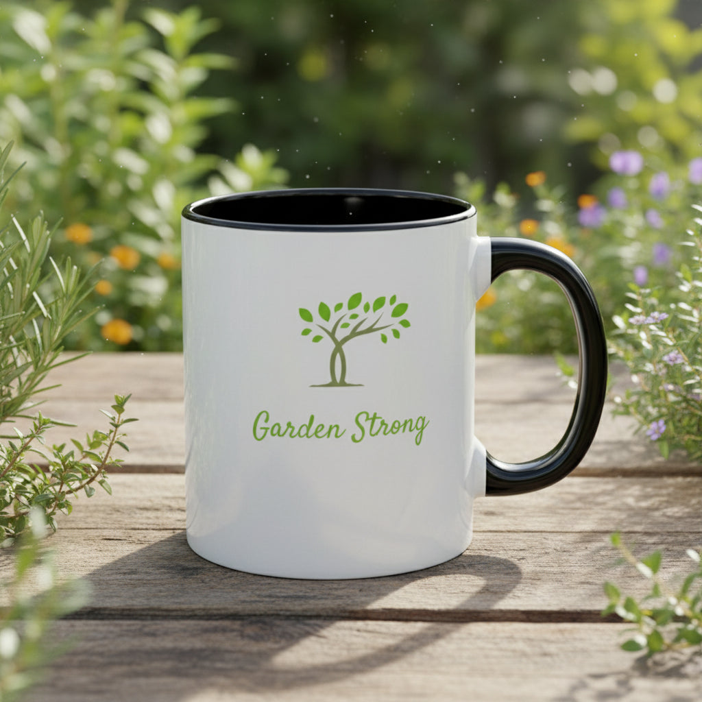 White mug with black interior and handle, featuring a green tree logo and 'Garden Strong' text on a beige background.