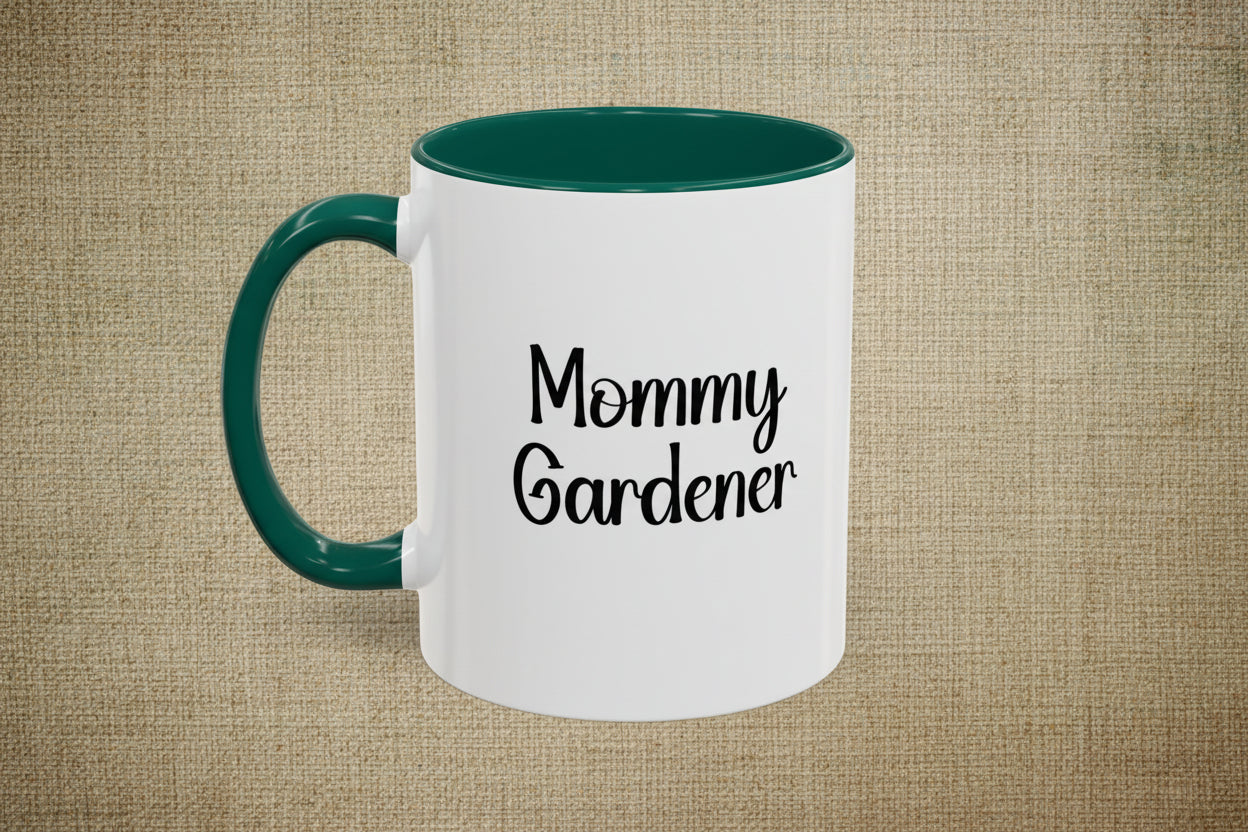 White mug with green handle and interior, featuring 'Mommy Gardener' text on a beige background