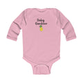 Pink baby onesie with 'Baby Gardener' and a pineapple graphic on a white background