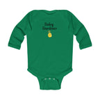 Green baby onesie with 'Baby Gardener' text and pineapple graphic on a white background