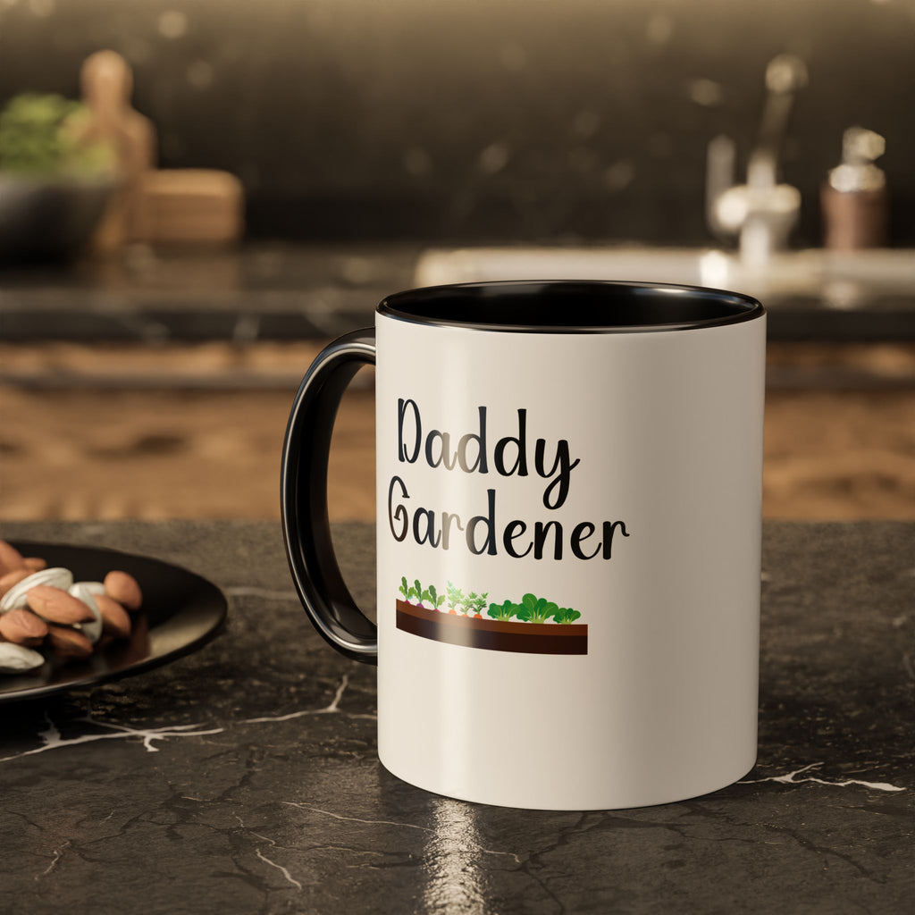 White mug with black interior and handle, featuring 'Daddy Gardener' text and gardening graphic on a kitchen counter.