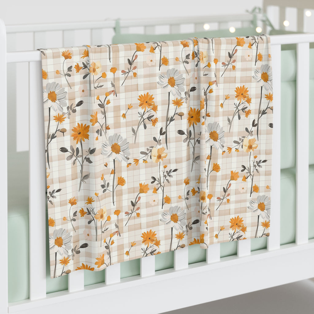 Floral patterned curtain hanging on a white window frame