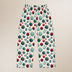 Pajama pants with a pattern of colorful baubles on a beige background