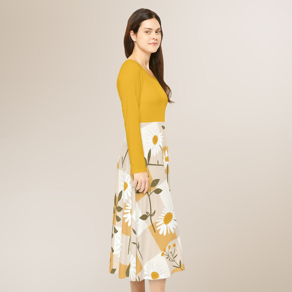 Woman wearing a mustard yellow top and floral skirt on a beige background