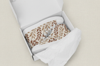 Pair of socks with leaf pattern in a white box