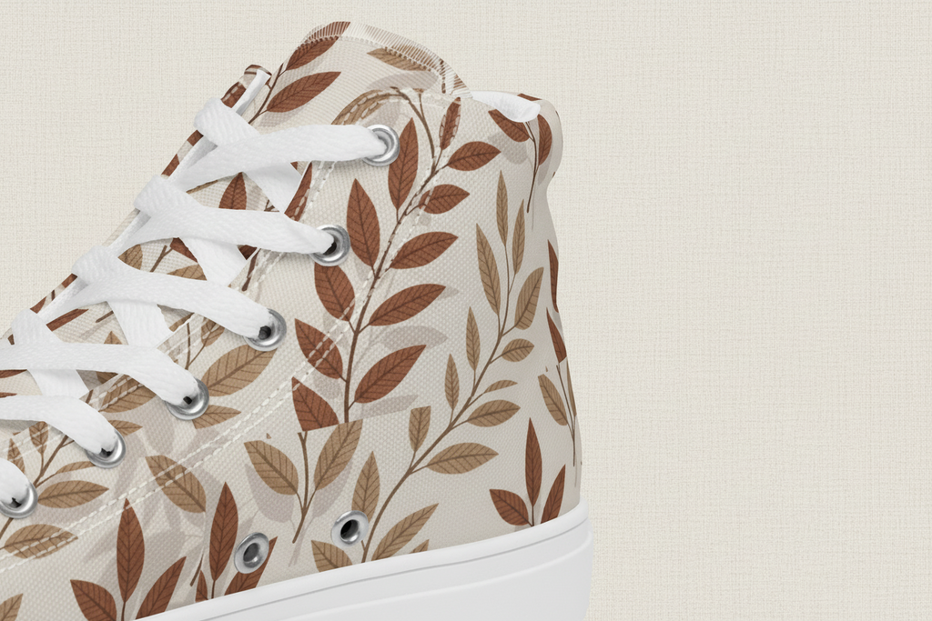 High-top sneaker with leaf pattern on a white background