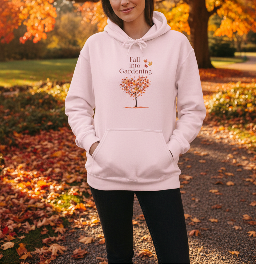 Pink hoodie with 'Fall into Gardening' text and tree graphic on a beige background