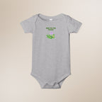 Gray baby onesie with 'New to the Patch' text and graphic on a beige background