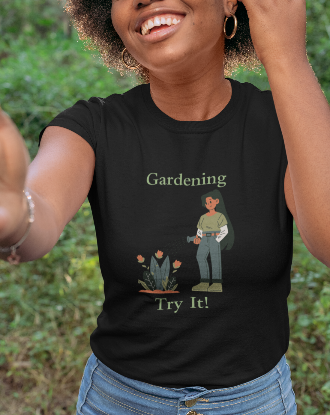 Person wearing a black t-shirt with a gardening graphic and text outdoors