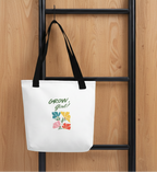 tote bag against a brown panel wall. hanging
