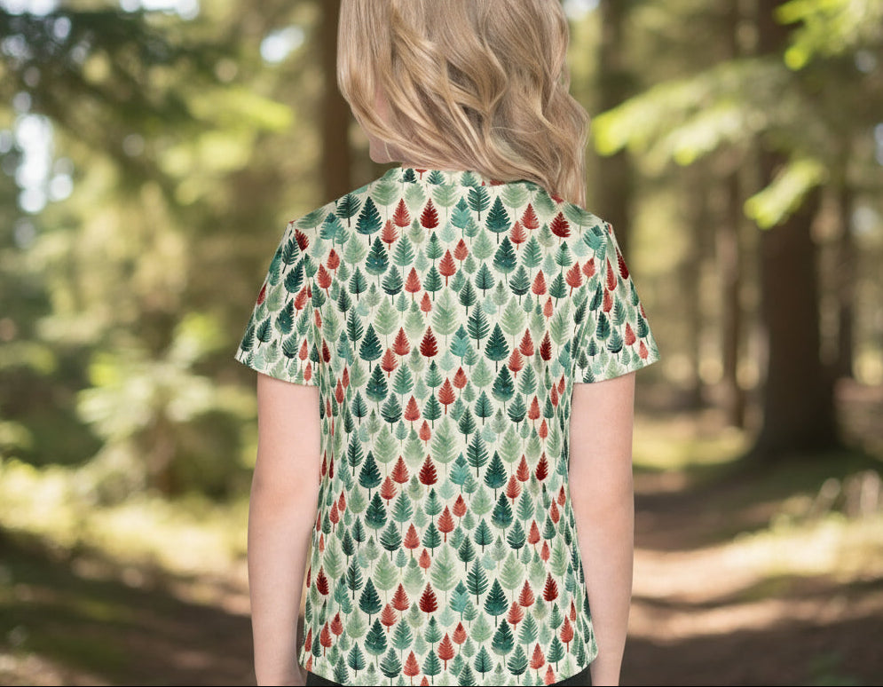 Person wearing a patterned shirt in a forest setting