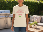 Person wearing a t-shirt with text and tulip design outdoors