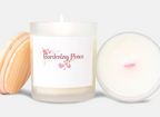 Candle with 'Gardening Peace' text and heart designs on a white background