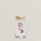 Clear glass jar with straw and wooden lid, featuring 'Mom, Best Grower' text and floral design on a white background.